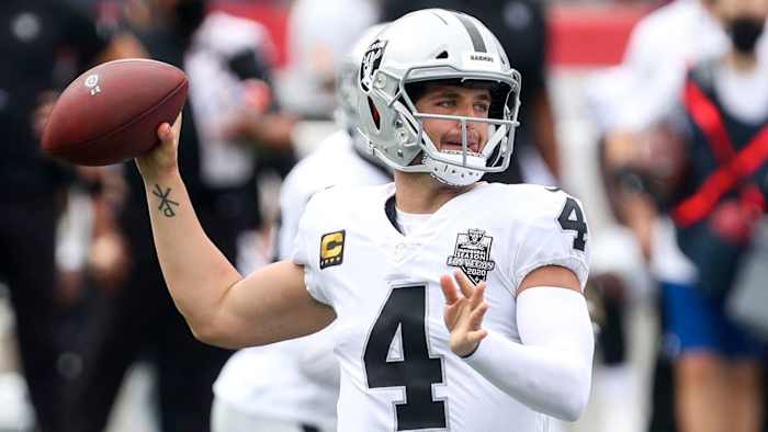 Las Vegas Raiders quarterback Derek Carr (4) passes the ball during the first half against the New England Patriots at Gillette Stadium.